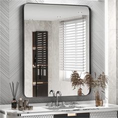 a bathroom with a mirror, sink and vase on the counter in front of it