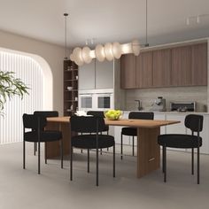 a dining room table surrounded by black chairs