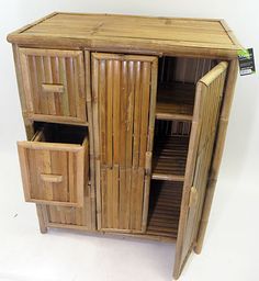 a wooden cabinet with two drawers and one door open