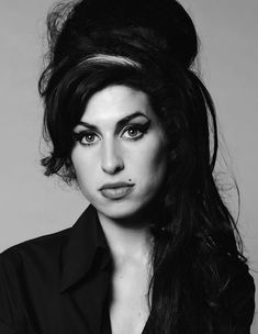 a black and white photo of a woman with long hair