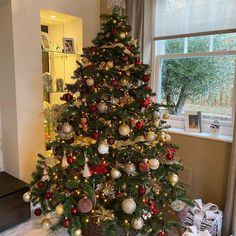 a decorated christmas tree in a living room