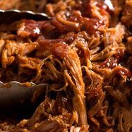 shredded pulled pork with bbq sauce in a bowl