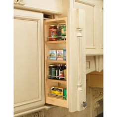 an open cabinet in a kitchen filled with food