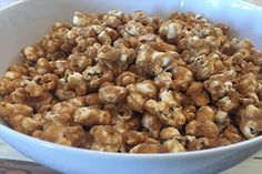 a white bowl filled with caramel popcorn