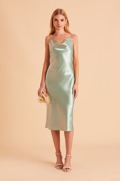 A fresh take on the 90s classic, our Lisa Satin Midi in sage is the *perfect* satin bridesmaid dress youve been looking for. Spun from a super luxe, shiny poly satin, she features skinny adjustable straps and light cowling in a bias-cut midi silhouette. Needless to say, shes our top wear-again dress that you can easily style with a slouchy sweater and a boho hat for farmers market runs or a fun date night. Slip Bridesmaids Dresses, White Dresses For Sale, Sage Bridesmaid Dresses, Tuxedo Women, Birdy Grey, Boho Hat, Slouchy Sweater, Chic Shop, Bridesmaid Accessories