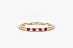 "Ruby and Diamond Wedding Band in 14k Gold / Stackable Genuine Ruby Ring / July Birthstone / Rose Gold and White Gold Features ✔Made to Order ✔Gold Kt: 14K ✔Available Gold Color: Rose Gold, Yellow Gold, White Gold ✔Gemstone: Genuine White Diamonds ✔Round Cut Diamond: 3 Pcs 1.5MM ✔Round Cut Ruby: 4 Pcs 1.5MM ✔Number of Stones: 7 ✔Stone Size: 1.5MM ✔Total CTW: 0.11 ✔ Diamond Color-Clarity: G Color SI Clarity ✔Ready to Ship in 7-10 Days ★ ★ ★ Each order will be beautifully packaged for gift giving Yellow Gold Multi-stone Diamond Ring For Wedding, Yellow Gold Multi-stone Diamond Wedding Ring, Wedding Multi-stone Yellow Gold Diamond Ring, Red Wedding Rings With Single Cut Diamonds, Red Single Cut Diamond Wedding Rings, Red Diamond Half Eternity Ring For Wedding, Red Half Eternity Diamond Ring For Wedding, Birthstone Band, Ring Rosegold