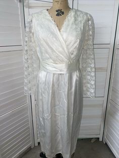 Vintage 70s 2nd Wedding Dress Midi Satin Lace Long Sleeves Tie Sz Med Or Large Off white. Zipper back. Sheathe. Bodice is lined in the front, lace over satin deep v neck. Sheer lace sleeves. Measurements Pit to pit 19" Waist 15.5" Sleeves 15" Length to waist 15" Length to hem 44.5" A stunning dress. Very clean. No flaws to note. Looks new. 2nd Wedding Dress, Wedding Dress Midi, 2nd Wedding Dresses, Midi Wedding Dress, 2nd Wedding, Dress Midi, Lace Sleeves, Stunning Dresses, Sheer Lace