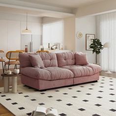 a living room filled with furniture and a rug