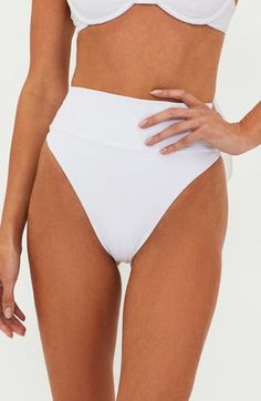 A flouncy bow adds extraspecial energy to these solid bikini bottoms done in a high-waist silhouette. Cheeky back coverage 68% nylon, 17% Lurex® metallic fibers, 15% spandex Machine wash, tumble dry Made in the USA Summer White Bottoms With Contoured Waistband, White Bottoms With Contoured Waistband For Summer, White High-waisted Stretch Swimwear, White Stretch High-waist Swimwear, White Fitted Swimwear With Wide Waistband, White High Waist Bottoms With Contoured Waistband, White Brief Bottoms For Poolside, White High-cut Leg Swimwear For Pool, White High Waist Bottoms For Pool