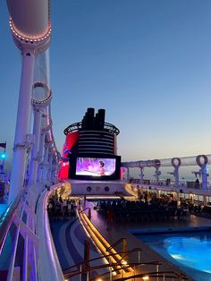 a cruise ship with a large screen on it's side