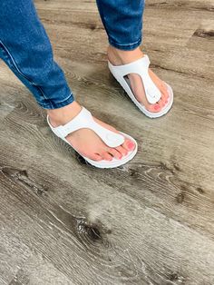 White Lightweight Slip-on Sandals, Lightweight White Sandals With Arch Support, White Non-slip Flat Jelly Sandals, Non-slip White Flat Jelly Sandals, White Non-slip Comfortable Slippers, White Non-slip Eva Slippers, White Adjustable Non-slip Sandals, White Closed Toe Synthetic Jelly Sandals, Slip-resistant Open Toe Flip Flops