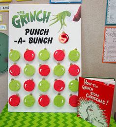 the grinch punch - a - bunch game is set up in front of a bulletin board