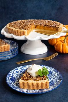 there is a pie on the table with other desserts around it