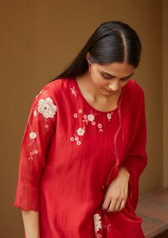 Editor's Note This Kurta Set Features An Asymmetric Play Of Floral Appliqué And Skilled Thread-work. This Look Is Complete With Sheer Lace Panel Bottoms And A Scallop-edged Dupatta With Tassels That Elevate The Ensemble. Color: Red Fabric: Muslin Cotton Care: Dry Clean Only About the Designer Vaayu stems from the new ethos of thoughtful and personal design which connects the wearer to the maker. We work closely with craftsmen and weavers across the country to create conscious clothing for everyd Applique Kurta, Scallop Dupatta, Blouse Yoke, Applique Work, Kurta Set For Women, Embroidery On Kurtis, Kurti Embroidery Design, Elegant Blouse Designs, Kurta Designs Women