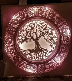 a lit up plate with a tree on it