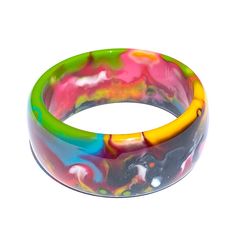 Chunky bangle bracelet with colorful marbled design 2.5"D Made from colored resin Note: Each piece is handmade and one-of-a-kind. Patterns and coloring will vary Free shipping! Designed in South Florida and made in Brazil. Sticks Furniture, Resin Bangles, Hot Plates, Store Signs, Made In Brazil, Hot Pads, South Florida, Cleaning Household, Bangle Bracelet