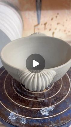 a white bowl sitting on top of a table