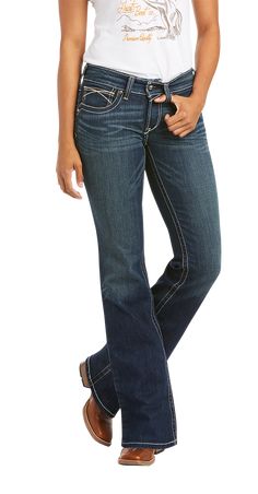 Ariat R.E.A.L. Mid Rise Stretch Whipstitch Bootcut Jeans for Ladies are tough enough for your workday, but finished with whiskering, fading, and fashion stitching so you can wear them everywhere. These Ariat riding jeans are made of stretch denim to fit your body perfectly, and they hold that fit without sagging in the seat or gapping in the waist. They have a medium wash, 5 pockets, a zip-and-button fly, and a mid-rise waist to give you coverage when you're active. Ariat R.E.A.L. Mid Rise Stret Western Style Mid-rise Dark Wash Flare Jeans, Western Style Dark Wash Mid-rise Flare Jeans, Western Style Mid-rise Denim Jeans, Western Mid-rise Denim Blue Jeans, Jeans For Ladies, Capsule Wardrobe Casual, Ariat Jeans, Riding Jeans, Pocket Jeans