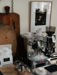 a coffee machine sitting on top of a wooden table