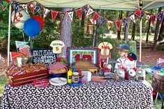 an outdoor picnic area with food and decorations