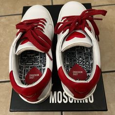 Only Worn Once! Moschino White Sneakers With Red Detailing. Cute Little Red Heart On The Tongue Of The Shoe And The Heel, Red Shoelaces, And “Love Moschino” Printed On The Side. White And Red Sneakers, Love Moschino Shoes, Moschino Shoes, Red Sneakers, Love Moschino, White And Red, Heart On, White Sneakers, Red Heart