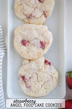 three strawberry angel food cake cookies on a white plate