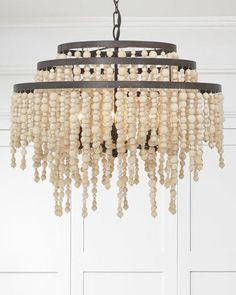 a chandelier with beads hanging from the ceiling