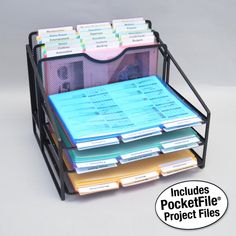 a stack of file folders sitting on top of a metal holder filled with files