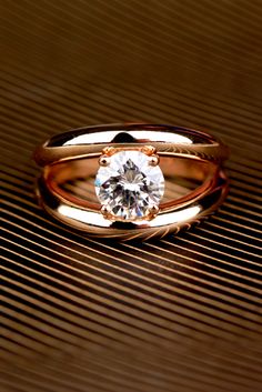 a gold ring with a diamond in the center