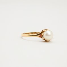 R I N G WITH WHITE PEARL ∙  * Details: Solid Gold ∙ 14K Gold ∙ Yellow Gold * Stones: white pearl * Weight: 0.8 grams * Ring size: 7¾ * Condition: All our pieces are vintage, antique or close to new. The piece undergoes a restoration proces, which includes ultrasonic cleaning and mild polish techniques to enhance the condition of the piece. * All our pieces are vintage and handpicked. We put a lot of effort into finding the most unique and beautiful items for you guys ♥️ Hope you like it A U T H Formal Pearl Ring With Prong Setting, Classic Gold Pearl Ring With Pearl Charm, White Pearl Ring With Prong Setting For Formal Occasions, Formal White Pearl Ring With Prong Setting, Classic Pearl Drop Ring, Classic Pearl Charm Ring For Wedding, Classic Pearl Ring With Pearl Drop, Classic Round Pearl Ring With Pearl Drop, Classic Oval Pearl Ring For Anniversary