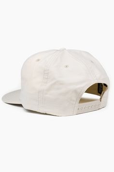 a white baseball cap with an embroidered patch on the front and side, sitting against a white background