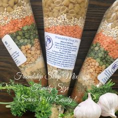 three bags of food sitting on top of a table next to garlic and parsley