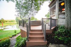 there is a deck with stairs leading up to the house