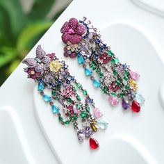 Kindly check out the Jhumka Kundan earrings section, where you can find more unique designs!  https://www.etsy.com/shop/VelvetVineEarrings?ref=seller-platform-mcnav&section_id=50758956 keywords: Jhumka Kundan earrings/statement colorful quartz dangles/wedding jewelry/cultural accessory/traditional anniversary/multi-stone handmade  👄Item details:  Originally designed by me and crafted in our Denver, Colorado studio, our family business thrives with the invaluable contributions of my brother and cousin, who play key roles in creating our items and maintaining our Etsy shop. Specifications: *Length:55mm *Width: 35mm *Materials: Stainless steel, vibrant quartz stones, handmade settings, featuring original vintage Kundan Jhumka designs.  Shipping: *Ships within 7 days from Denver, with free do Jhumka Designs, Quartz Color, Kundan Earrings, Earrings Statement, Denver Colorado, Multi Stone, Family Business, Quartz Stone, Statement Earrings