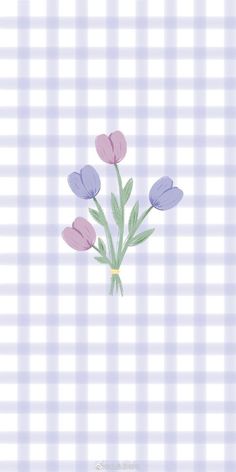 some purple and pink flowers on a checkered table cloth