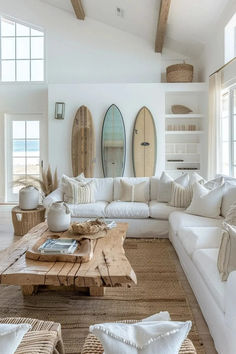 a living room filled with lots of white furniture