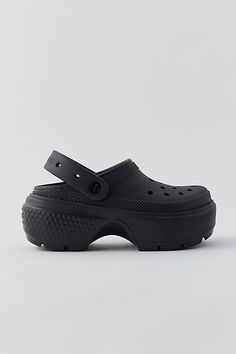 The Crocs comfort you love, plus an extra dose of dynamic style. The Crocs Stomp clog features added height for a bit of an edge. Iconic Crocs Comfort keeps them lightweight, flexible, breathable and buoyant. Features Crocs Stomp clogs Platform Crocs with a chunky style Slip-on style Content + Care 100% Croslite foam Wipe clean Imported Size + Fit Platform: 2" Heel height: 3" | Crocs Stomp Clog in Black, Women's at Urban Outfitters Clogs Platform, Platform Crocs, Love Plus, Black Fits, Cleaning Wipes, Clogs, Urban Outfitters, Heel Height, Sign Up