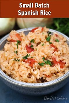 small batch spanish rice in a bowl with tomatoes and parsley on the side text reads small batch spanish rice