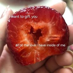 someone holding up a piece of fruit with the words i want to gift you all of the love i have inside of me