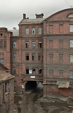 an old brick building with lots of windows