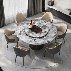 a round marble dining table with six chairs around it and a bottle of wine on top