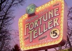 the fortune teller sign is lit up for everyone to know it's 5 cents