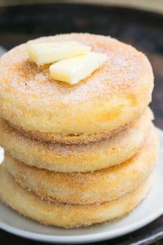 a stack of pancakes with butter on top