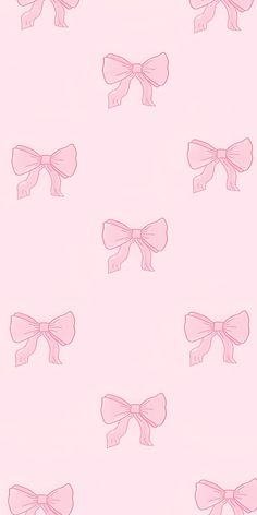 pink bows on a light pink background are the perfect backdrop for this wallpaper design