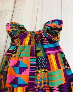 Beautiful multicolor dress. This is the perfect everyday dress for your little one. Easy to put on Care instructions: Machine wash cold Hang to dry Warm iron Please check out our shop for more print and many more designs. ragabyhawa.etsy.com Dress With Head Wrap, Dress Ankara, Baby Girls Dress, African Skirts, African Dresses For Kids, Everyday Dress, Girls Pink Dress, African Dresses, Multicolor Dress