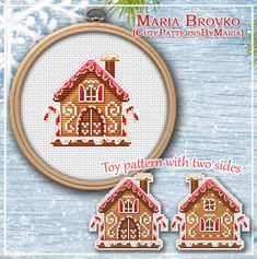 a cross stitch pattern with two houses in the snow