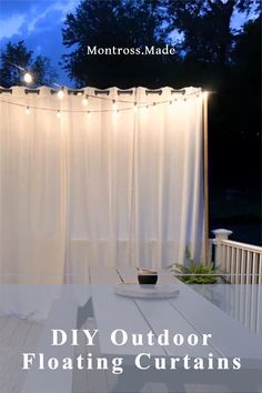 an outdoor table with lights on it and the words, diy outdoor floating curtains