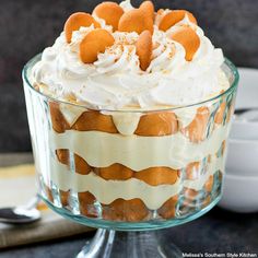 an orange and white dessert in a glass dish