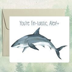 a card with an image of a shark and the words you're fin -tastic, alex +