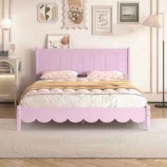 a pink bed with scalloped headboard and foot board in a white bedroom